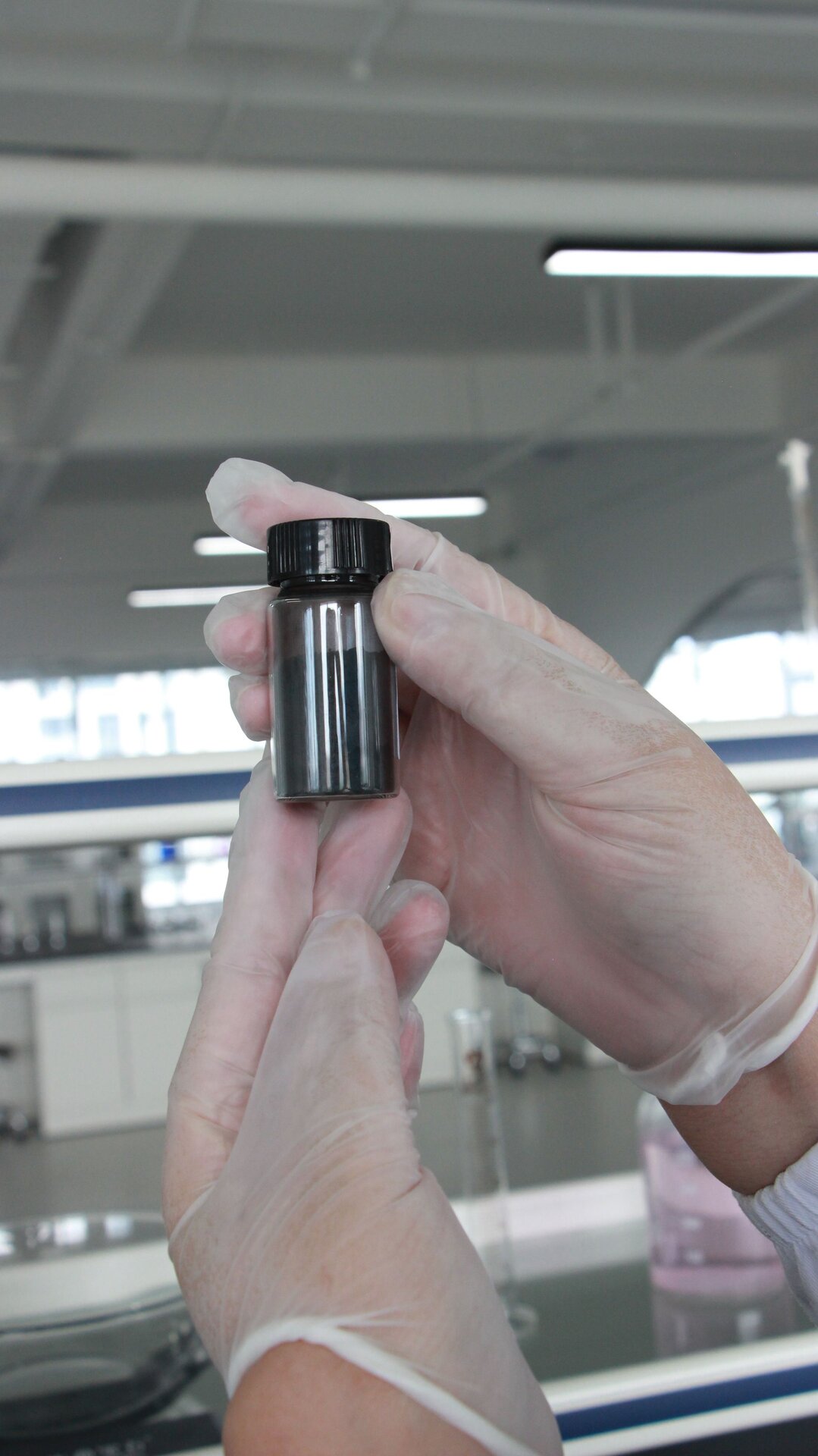 Carbon powder extracted from ancestral cypress root, sealed in laboratory vial