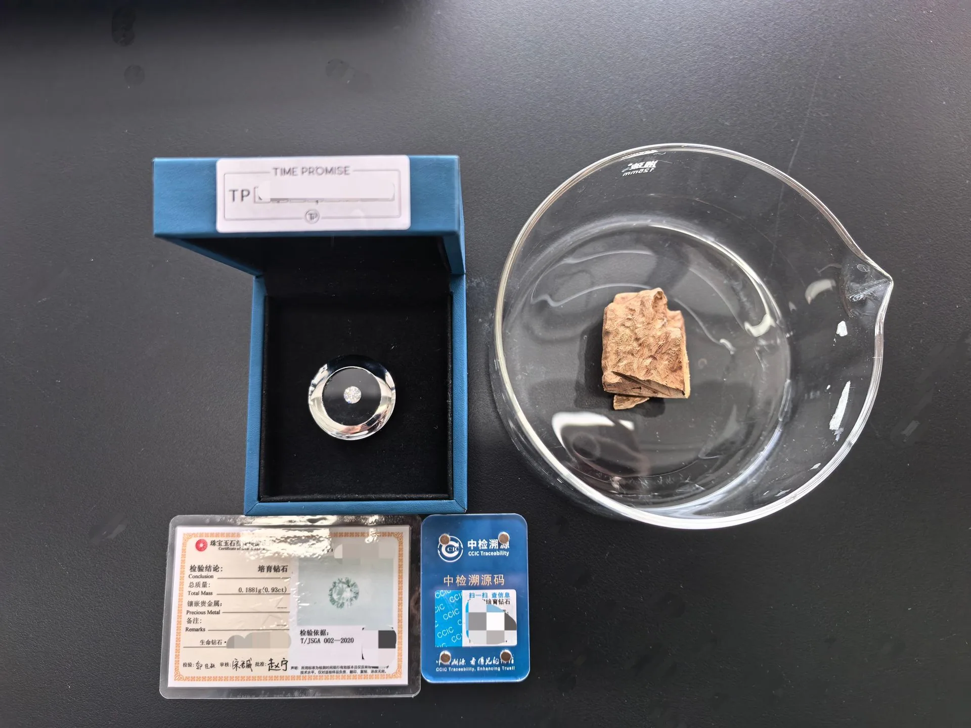 CCIC traceability card and diamond grading certificate beside a finished memorial diamond in its presentation case