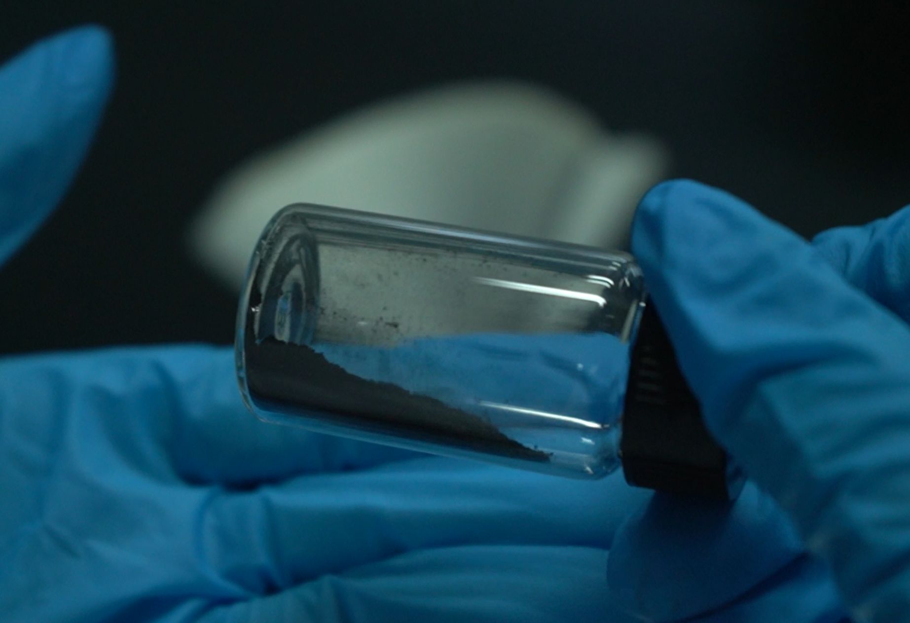 Purified carbon powder from camel wool in glass vial