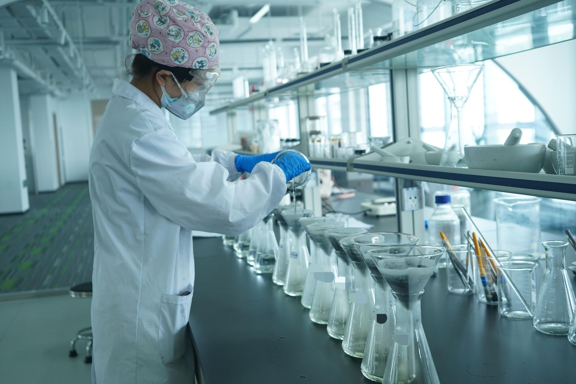 Lab technician working with equipment during botanical carbon diamond synthesis