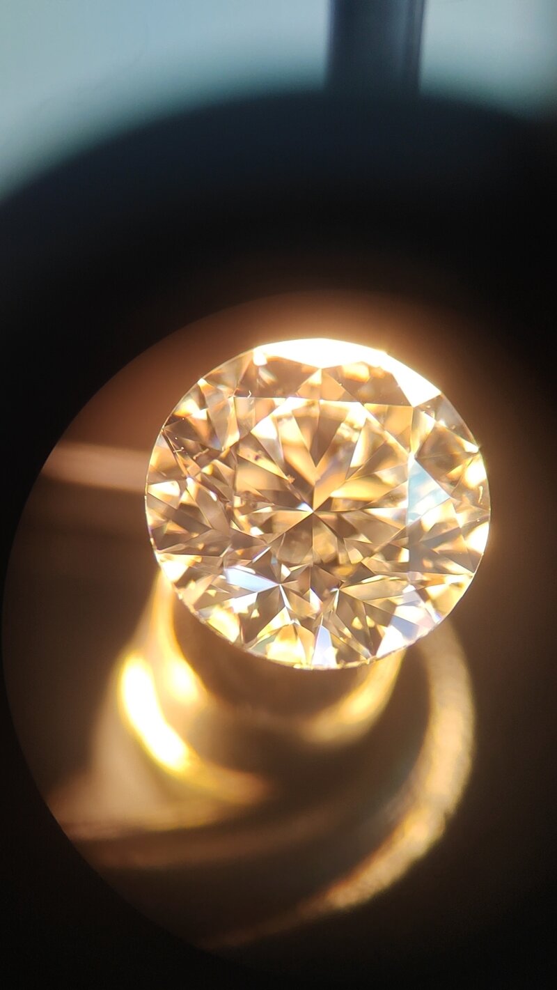 Diamond microscope inspection showing quality control and certification verification process for memorial diamonds