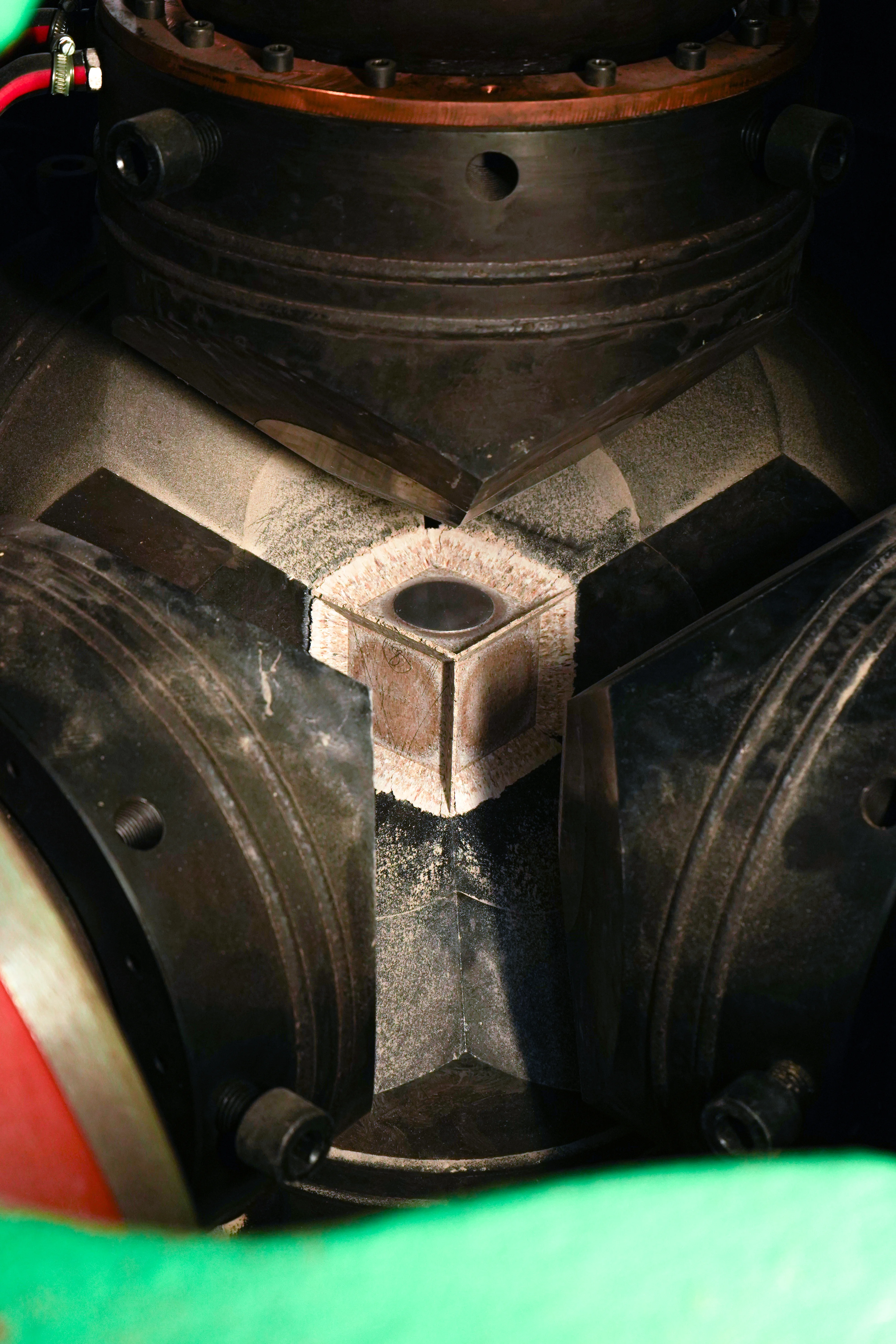 HPHT synthesis chamber closeup — industrial diamond manufacturing equipment