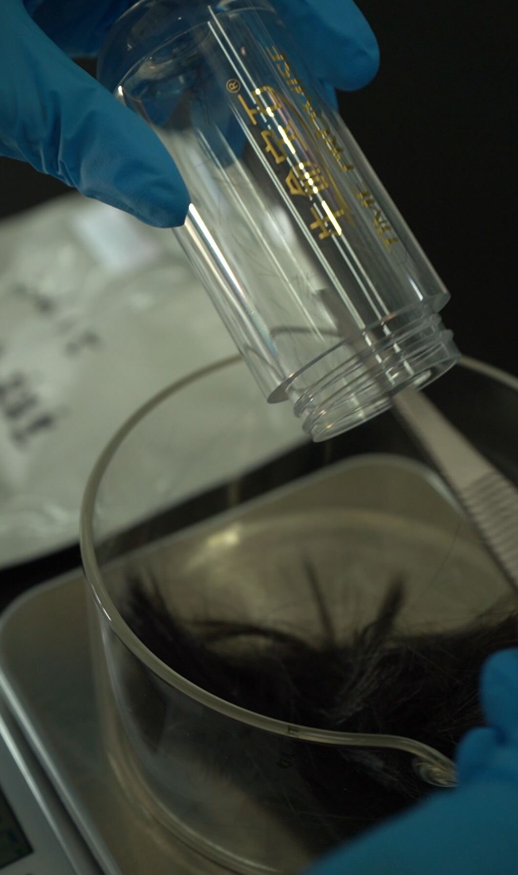 Technician operating HPHT synthesis equipment in the central laboratory