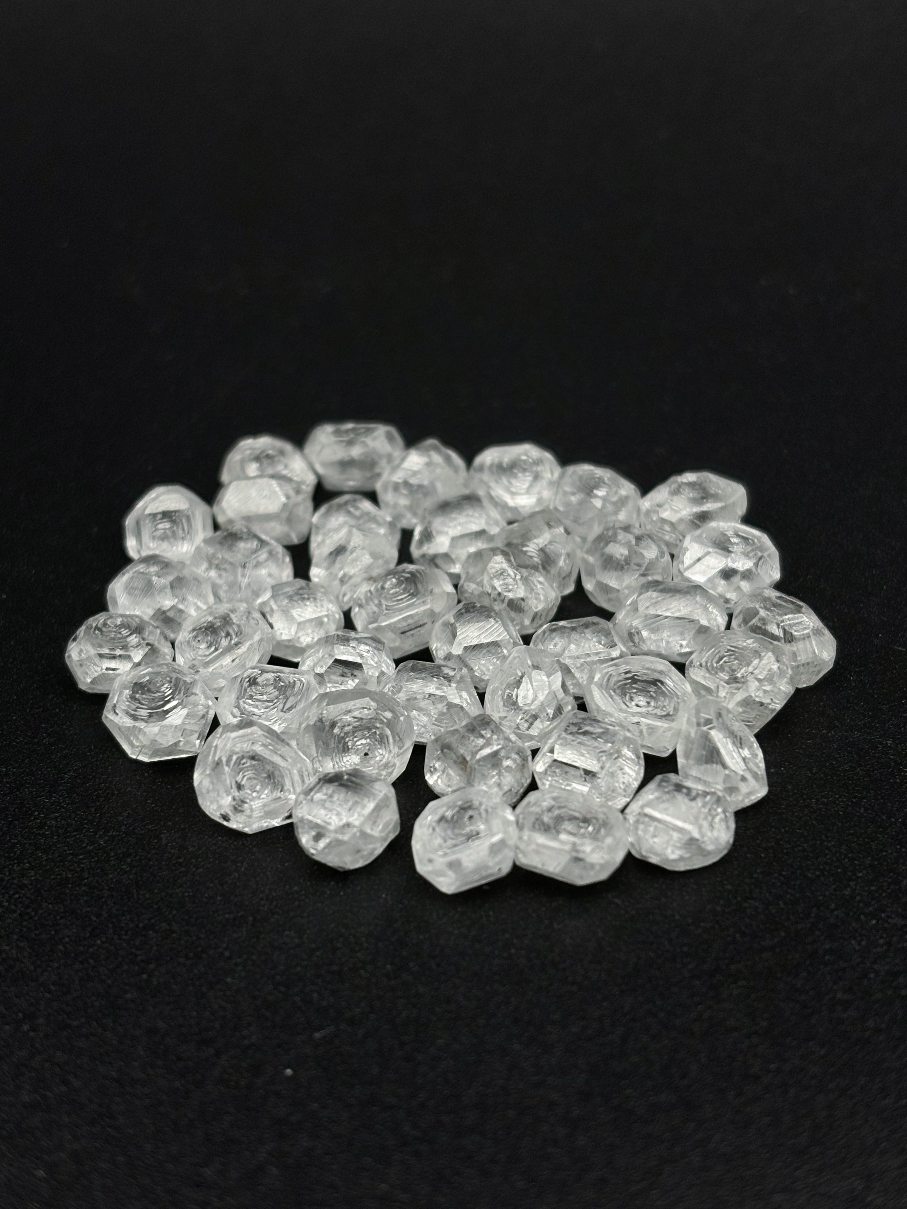 Raw diamond crystal as it appears immediately after HPHT synthesis, before cutting or polishing
